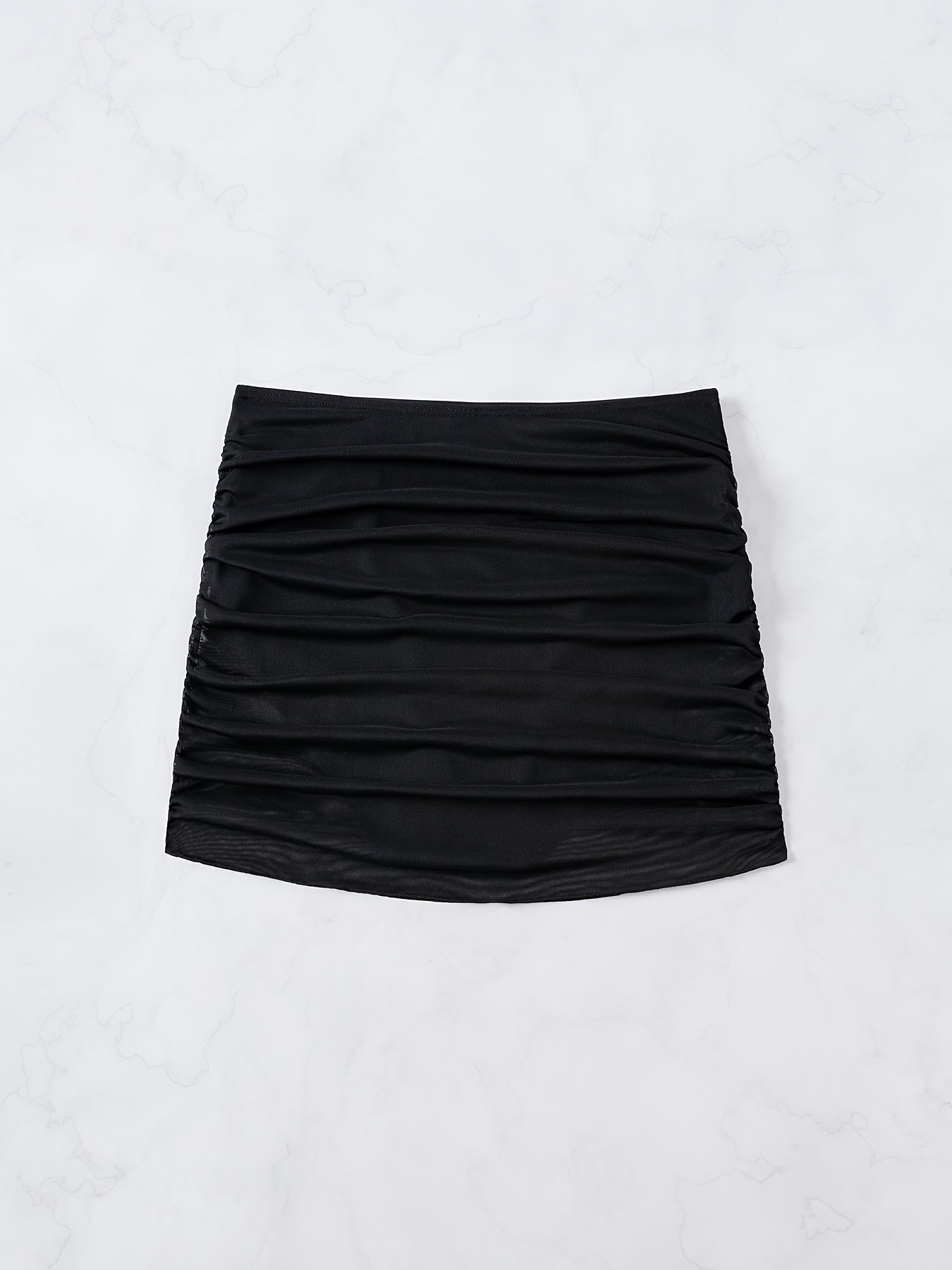 Flat lay of rushed mesh mini skirt in black from Alternative Darkwear

Ready for the n