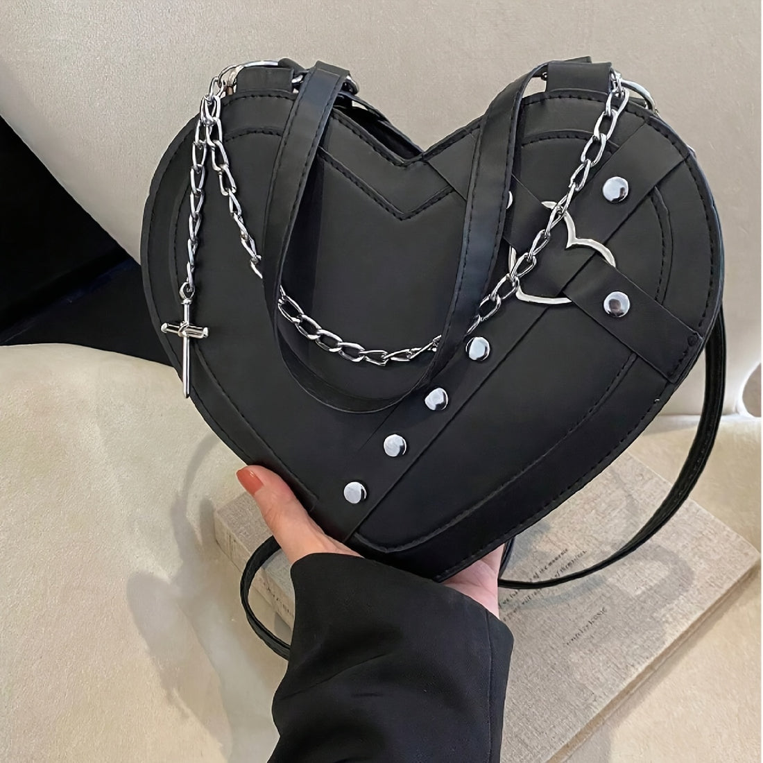 Gothic heart-shaped chain shoulder bag in black PU leather with silver chain strap and heart hardware from Alternative Darkwear