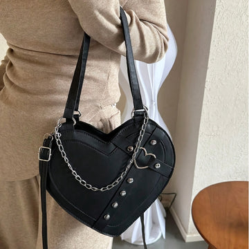 Gothic heart-shaped chain shoulder bag in black PU leather with silver chain strap and heart hardware from Alternative Darkwear
