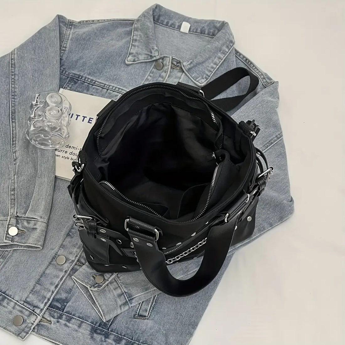 Large studded chain tote bag in black PU leather with rivet hardware and dual top handles from Alternative Darkwear