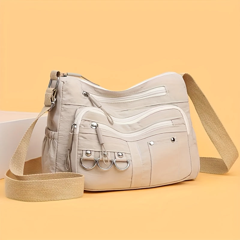 Multi-pocket hobo crossbody bag in beige from Alternative Darkwear