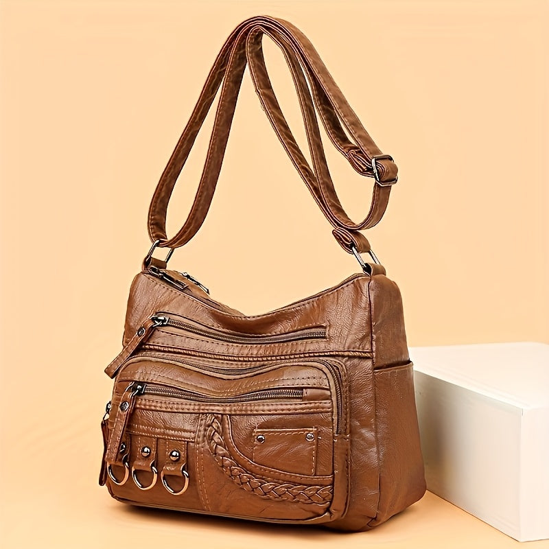 Black: Multi-pocket quilted PU shoulder bag in black with edge paint finish from Alternative Darkwear